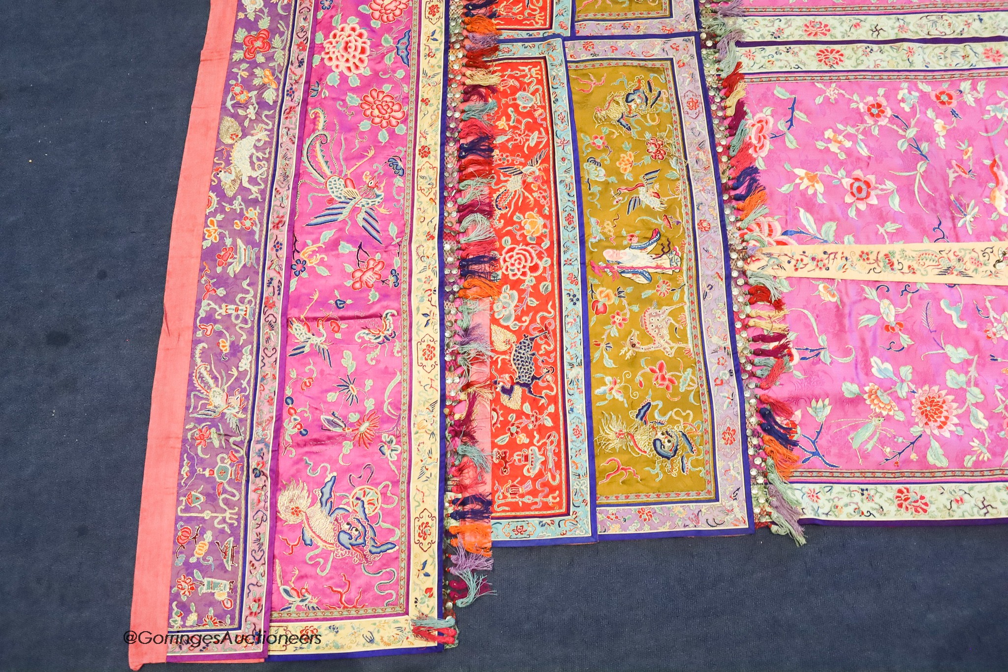 A pair of 20th century Chinese silk embroidered ceremonial panels, possibly for a wedding, 228cm not including fringing, each panel width 80cm, with a matching pelmet, width 198cm